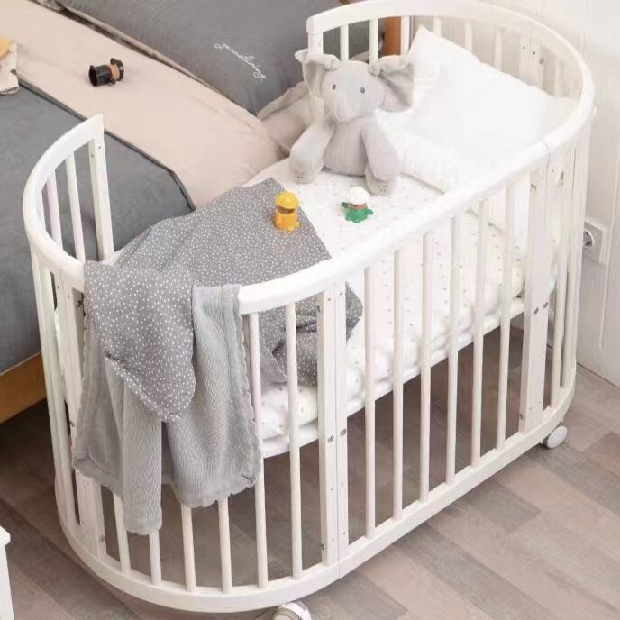 White Oval Baby Crib Convertible to Kids Sofa, Study Desk and Play Bed